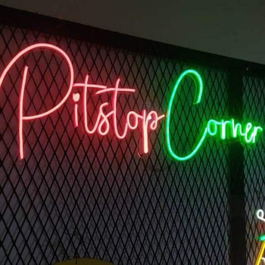 Neon sign pitstop corner